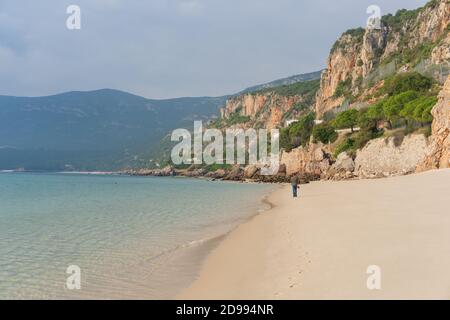 Man walking in Figueirinha beach in Arrabida park Stock Photo