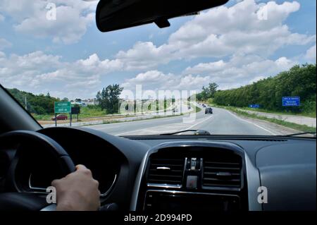 Pov of a man driving a car on the roads of Brazil. Stock Photo