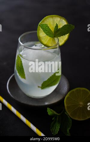 green lime and peppermint cocktail on black background. Fresh cocktails. Stock Photo