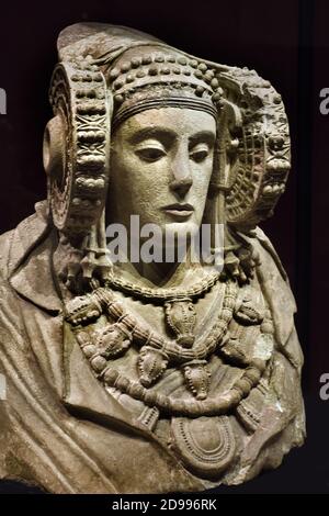 The Lady of Elche (Dama d'Elx in Valencian; Dama de Elche in Spanish) is a limestone bust sculpture of a woman, dated to the 5th or 4th century BC, discovered on August 4, 1897 on an ancient Roman site in Alcudia,  Spain, Spanish National Archaeological Museum of Spain Stock Photo