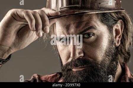 Man builders, industry. Builder in hard hat, foreman or repairman in the helmet. Building, industry, technology - builder concept Stock Photo