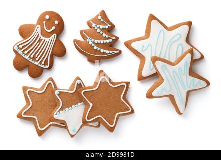 Gingerbread cookies. Stars, christmas tree and woman isolated on white background. Top view Stock Photo