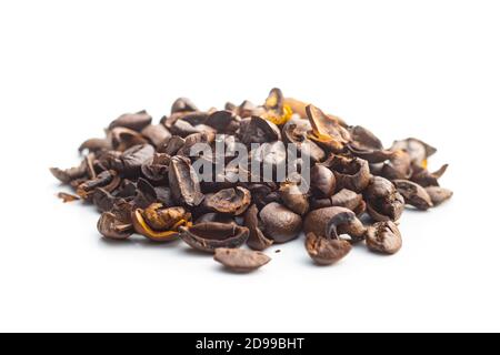 Cracked coffee beans isolated on white background. Stock Photo