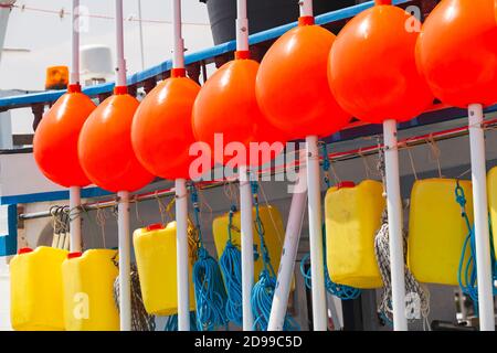 Fishing boat equipment, red floats in a row. Busan, South Korea Stock Photo
