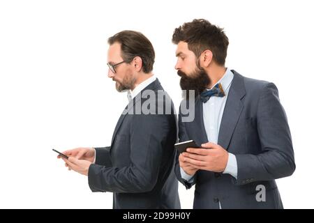secret business. business communication on meeting. team success. collaboration and teamwork. partnership of men speaking on phone. mature men. Agile business. bearded businessmen in formal suit. Stock Photo