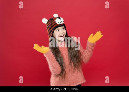 Capturing happy moment. holiday fun. cold season accessory. cheerful child in warm clothing. stylish teen girl with long hair in earflaps. winter kid fashion. happy childhood. christmas time activity. Stock Photo