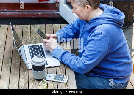 A female consultant doctor working from home during the coronavirus lockdown, London, UK Stock Photo