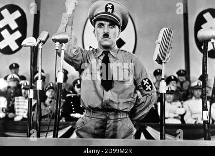 CHARLES  CHAPLIN  ( 1889 - 1977 ) as a HITLER look-a-like in  THE GREAT DICTATOR  ( 1940 - Il grande dittatore ) - nazi - nazist - nazism - nazismo - nazista - baffi - moustache - military uniform - uniforme militare - microfono - microphone - cravatta - tie - WWII - Seconda guerra mondiale ----  Archivio GBB Stock Photo