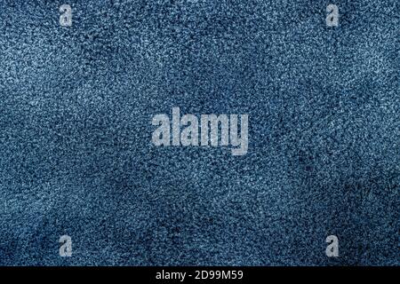 Texture of suede leather, genuine leather close-up, dark blue denim color, trendy background Stock Photo