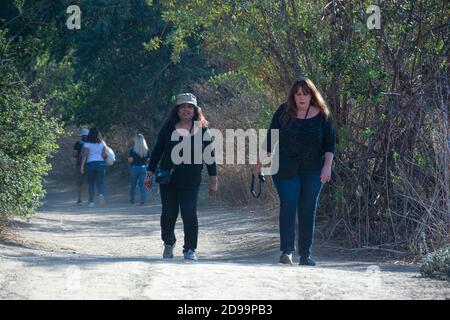 Two overweight women in their 50's on a hiking trail, Brea, California, USA Stock Photo