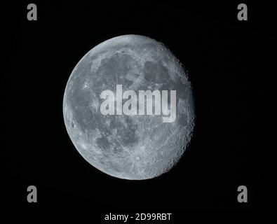 90.8% Waning Gibbous Moon with a heavily cratered terminator visible in clear overnight sky. Credit: Malcolm Park/Alamy. Stock Photo