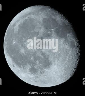 90.8% Waning Gibbous Moon with a heavily cratered terminator visible in clear overnight sky. Credit: Malcolm Park/Alamy. Stock Photo