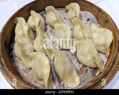 group of fresh dumplings on the steamer ready for eating Stock Photo