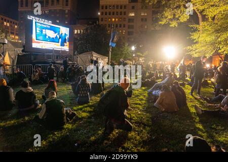 Washington, United States. 03rd Nov, 2020. Watch party goers gather at McPherson Square near the White House on election night in Washington, DC on Tuesday, November 3, 2020. Photo by Ken Cedeno/UPI Credit: UPI/Alamy Live News Stock Photo