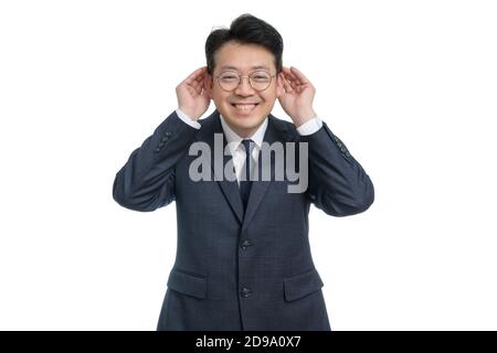 White background and gestures of an Asian middle-aged businessman. Stock Photo