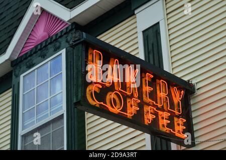 Mackinaw City, Michigan, USA. A local bakery that caters to visitors during the tourist season sports an old-fashioned neon sign above its entrance. Stock Photo