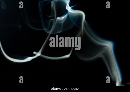 Abstract flowing Blue wispy smoke on dark background Stock Photo