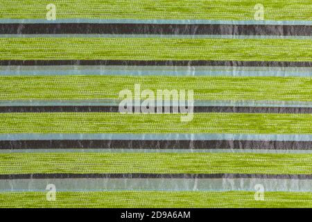 striped synthetic woven upholstery fabric close-up texture and background Stock Photo