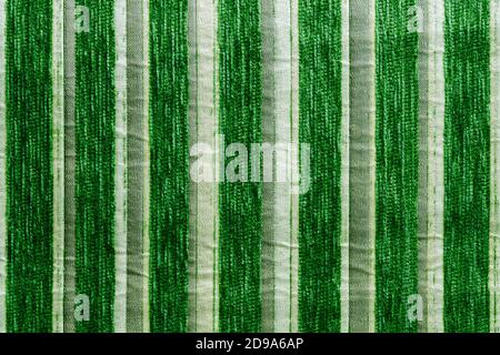 green striped synthetic woven upholstery fabric close-up texture and background Stock Photo