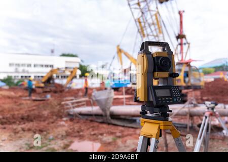 Theodolite equipment  of Surveyor builder engineer during surveying work in construction site Stock Photo