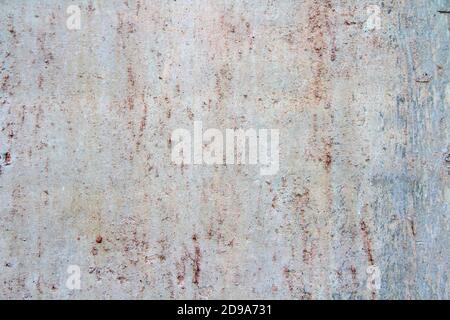 Retro concrete weathered wall old texture with rust leaks, with white, brown, gray and beige spots.. Design template. An old crumbling plaster. The background for text and design. Stock Photo