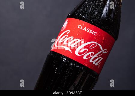 Tyumen, Russia-November 02, 2020: Coca-Cola logo non-alcoholic carbonated drink with water drops produced by the Coca-Cola Company. Stock Photo