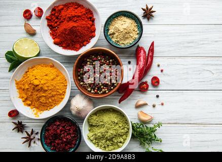 Various spices  on white wooden background, top view Stock Photo