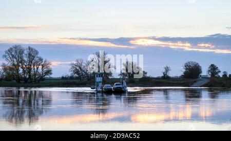 04 November 2020, Saxony-Anhalt, Rogätz: The Elbe ferry Rogätz sets the first commuters across the river at dawn. Central Germany is facing a sunny day. It will be colder than in recent days. Photo: Klaus-Dietmar Gabbert/dpa-Zentralbild/ZB Stock Photo