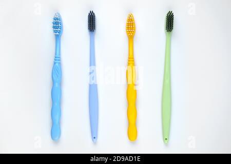 Four colorful toothbrushes. Isolated on white background Stock Photo ...