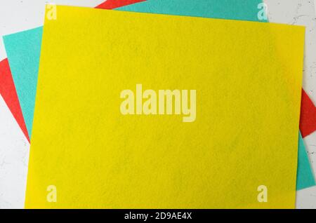 Mock-up of colorful napkins on the textured surface of the table. Stock Photo