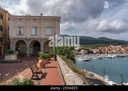 The Governor's Palace, in the background the tourist port of Porto Ercole. Porto Ercole, Grosseto,  tuscany, Italy, Europe Stock Photo