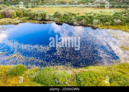 Aerial of lake in a peatbog by Clooney, Portnoo - County Donegal, Ireland. Stock Photo