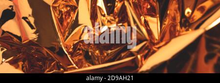 Blurred golden foil luxury texture. Creative banner with defocused background. Stock Photo