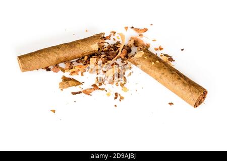 Broken tobacco cigarillo as a concept of quitting smoking. World No Tobacco Day. Isolated on white background, close up high resolution. Stock Photo