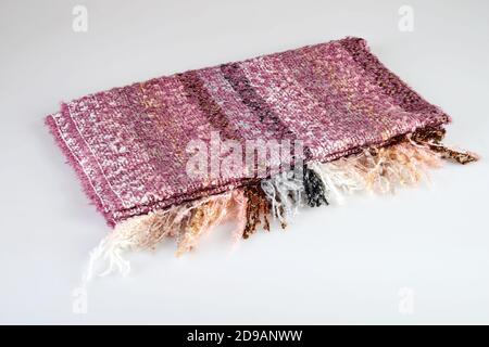 Muliticolored fabric of a elegant scarf on white background Stock Photo