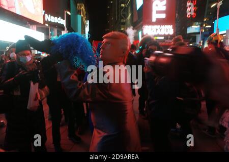 NEW YORK, NEW YORK: NOVEMBER 3, 2020- New York City Residents & Tourists alike gather in Times Square to monitor U.S. Presidential Elections between President Donald J. Trump and Democratic Presidential Candidate Joe Biden on November 3, 2020 in New York City. Photo Credit: mpi43/MediaPunch Credit: MediaPunch Inc/Alamy Live News Stock Photo