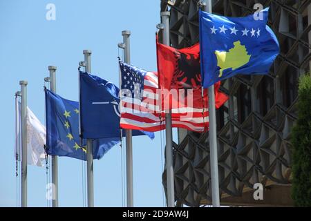 Flags of Kosovo, Albania, USA and the EU outside the National Library of Kosovo Stock Photo