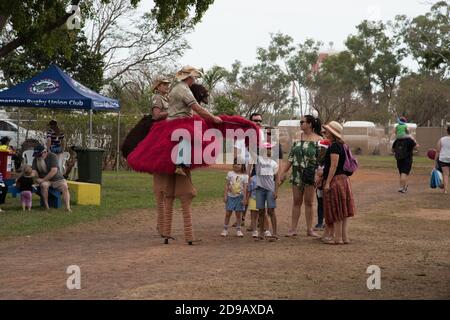 Darwin, NT, Australia-July 27,2018: Families interacting with stilt walkers in costume at the Darwin Show at the annual fairground event. Stock Photo