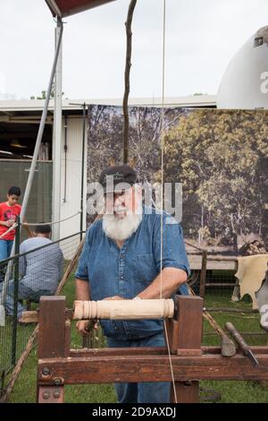 Darwin, NT, Australia-July 27,2018: Man showing the use of wood turning lathe with other tools at the Darwin Show fairground event. Stock Photo
