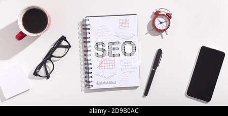 Word Seo On Notebook Over White Office Table Background, Collage Stock Photo