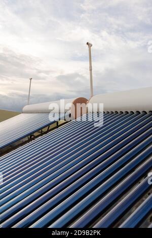 solar panels and tubes installed on roof top of houses and buildings to ...