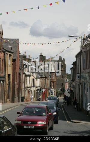 Maybole, Ayrshire, Scotland, Maybole is a town and former burgh of barony and police burgh in South Ayrshire, Scotland. Pop. 4,760. It is situated 9 miles south of Ayr and 50 miles southwest of Glasgow. At the bottom of the street is Maybole Castle one of the oldest buildings in the street Stock Photo