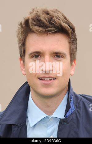 Greg James attends the Burberry Prorsum Menswear Spring/Summer 2014 catwalk show, Perks Field, Kensington Gardens, London. © Paul Treadway Stock Photo