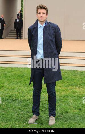 Greg James attends the Burberry Prorsum Menswear Spring/Summer 2014 catwalk show, Perks Field, Kensington Gardens, London. © Paul Treadway Stock Photo