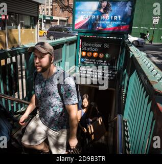 NEW YORK, USA - Sep 22, 2016: Young man with headphones coming out from New York City subway station. NYC Subway is one of the oldest and most extensi Stock Photo