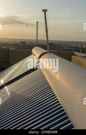 solar panels and tubes installed on roof top of houses and buildings to ...