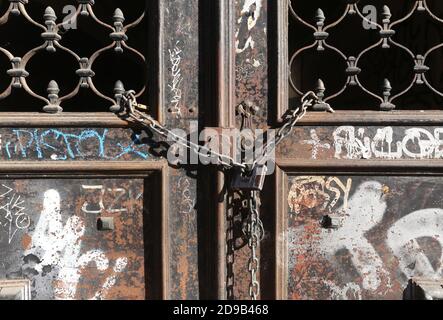 Cracow. Krakow. Poland. Old iron gate closed and locked with chain and padlock. Stock Photo