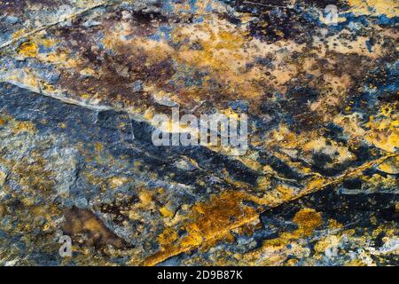 Rusty Metal Wall, Old Iron Sheet, Covered With Rust Multi-Colored Paint. Trace of Remnant of Old Paint in Large Deep Crack on Texture of Surface Stock Photo