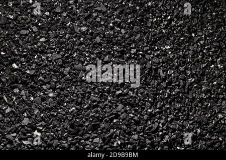 Close-up activated carbon texture. Coconut charcoal. Stock Photo
