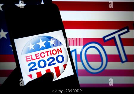 India. 4th Nov, 2020. In this Photo illustration ''Elections 2020'' is seen displayed on a smartphone screen with the background of US flag. Credit: Avishek Das/SOPA Images/ZUMA Wire/Alamy Live News Stock Photo